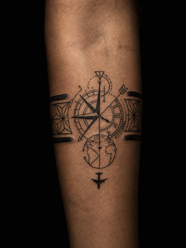 Compass with a clock, fine line tattoo on a forearm